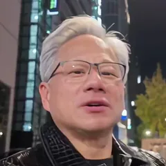 Grey-haired man in glasses and a black leather jacket